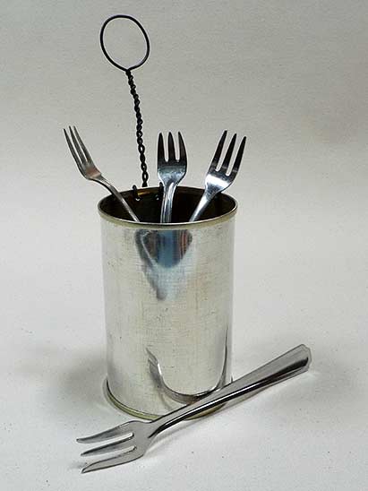 Joan Anderson useful scultpture with wire and found objects.